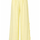Baobab Wayra pants in Limone color, featuring lightweight fabric and relaxed fit, perfect for casual or outdoor wear.