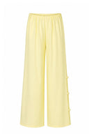 Baobab Wayra pants in Limone color, featuring lightweight fabric and relaxed fit, perfect for casual or outdoor wear.