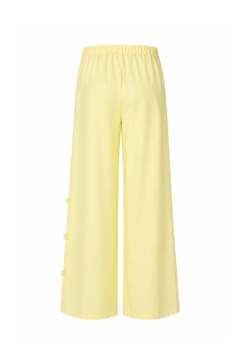 Baobab Wayra pants in Limone color, featuring a relaxed fit and lightweight fabric, displayed on a neutral background.