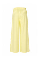 Baobab Wayra pants in Limone color, featuring a relaxed fit and lightweight fabric, displayed on a neutral background.