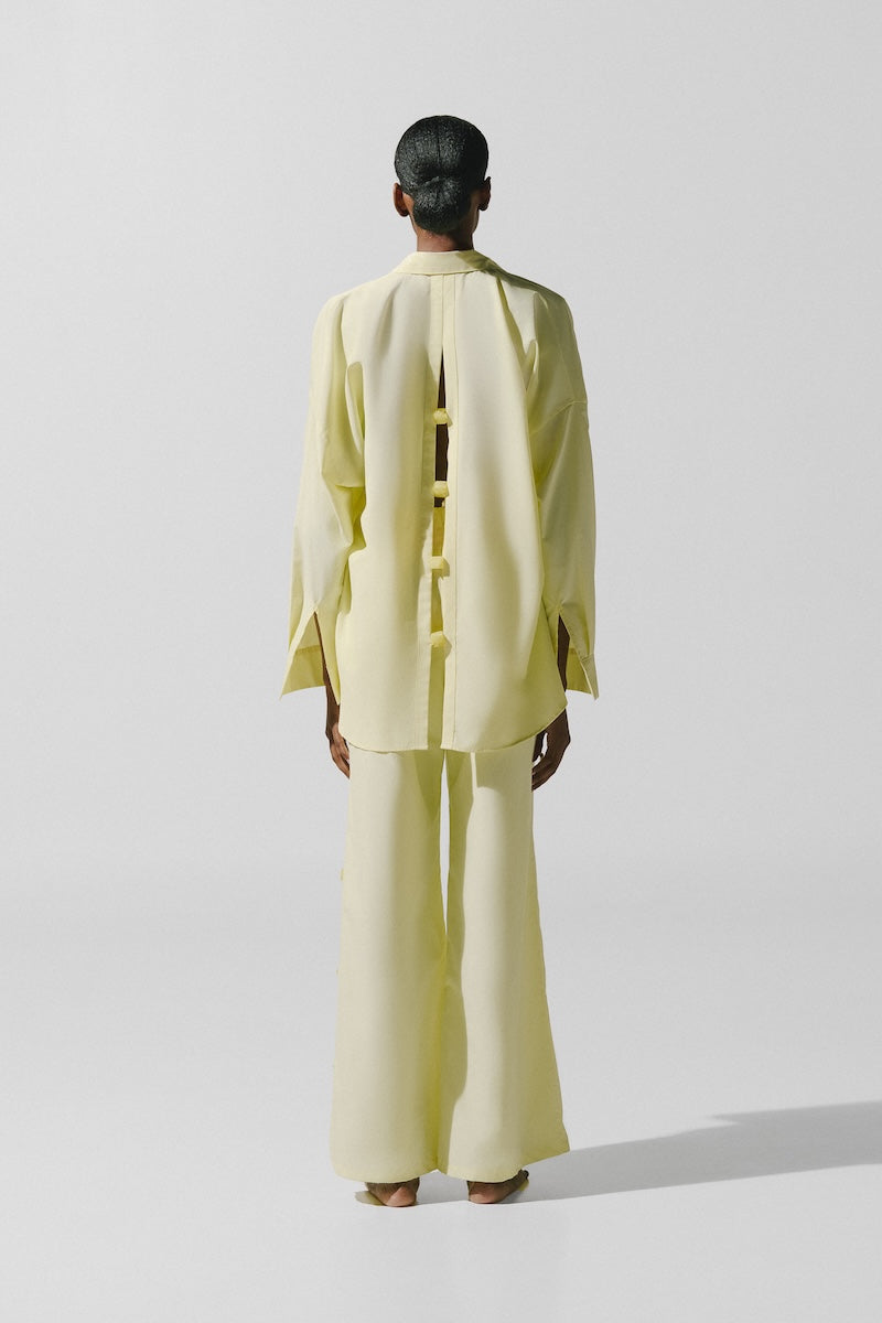 Baobab Wayra pants in Limone color, featuring a stylish relaxed fit and lightweight fabric perfect for casual wear.