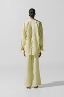Baobab Wayra pants in Limone color, featuring a stylish relaxed fit and lightweight fabric perfect for casual wear.