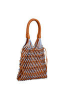 Blue and tan leather and suede shoulder bag by Adriana Castro, featuring a stylish design with contrasting textures.