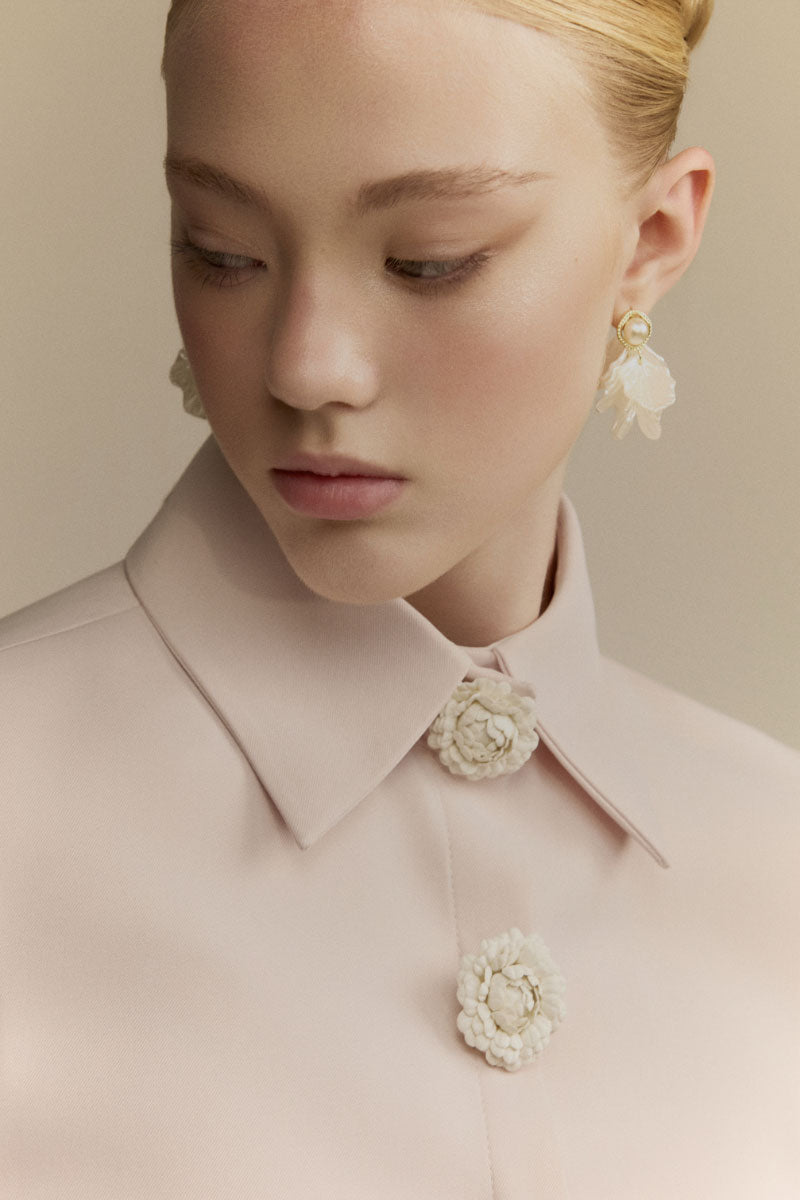 White Plan Quincy Midi Dress, sleeveless with floral pattern, displayed on a hanger against a neutral background.