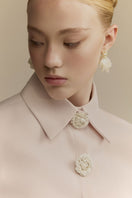 White Plan Quincy Midi Dress, sleeveless with floral pattern, displayed on a hanger against a neutral background.