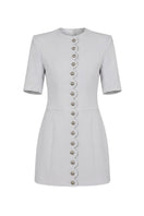 White buttoned mini dress by Keira Tong featuring a fitted silhouette and short sleeves, perfect for casual or dressy occasions.
