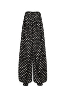 Black Valenciani jumpsuit with fitted design and sleeveless style, shown on a model in a full-length shot.
