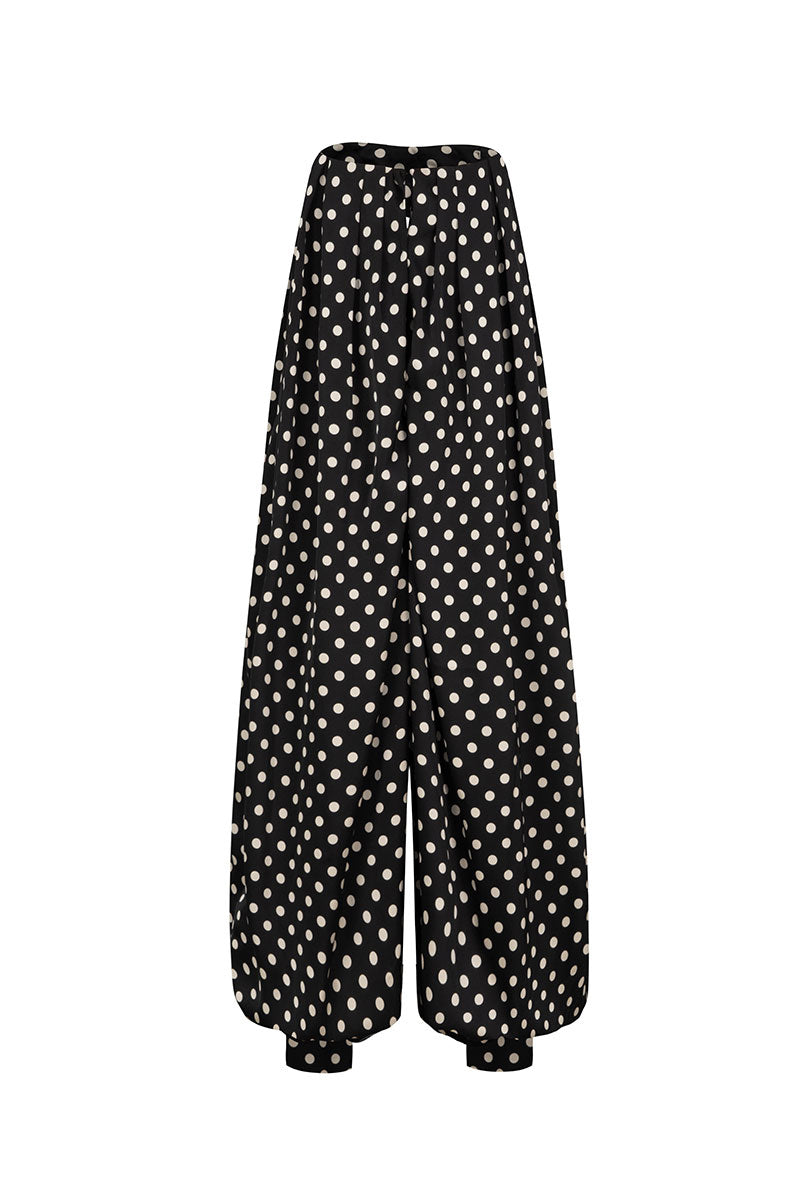 Black Valenciani jumpsuit with fitted design and sleeveless style, shown on a model in a full-length shot.