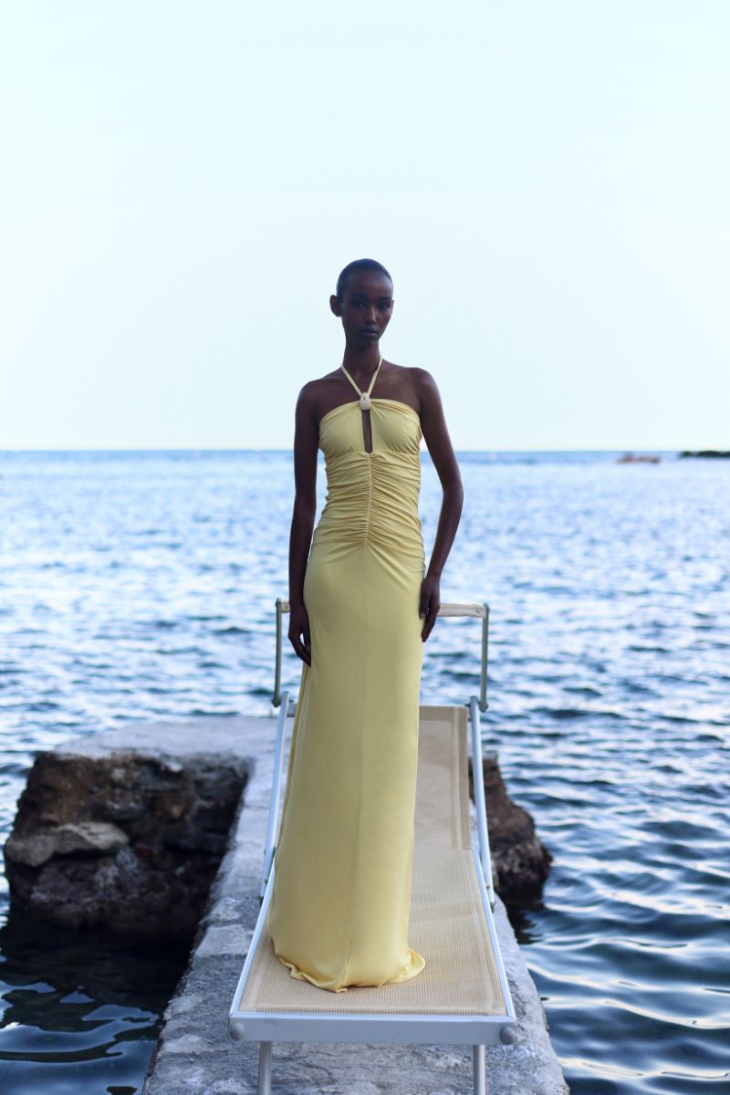 Baobab Romina Maxi Dress in light yellow with flowing fabric and sleeveless design, perfect for summer occasions.