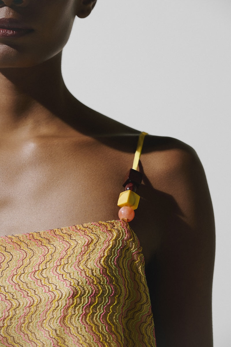 Baobab Porto Top in Festa, stylish women’s top with vibrant fabric and modern design, shown on a model.