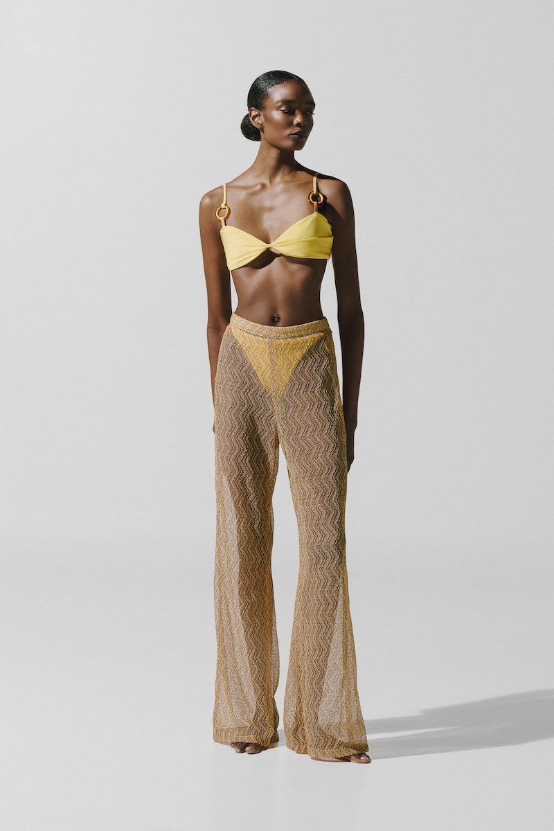 Baobab Porto Festa pants in stylish fabric, showing their tailored fit and detailed waistband on a neutral background.