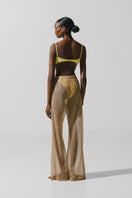 Baobab Porto Festa pants in vibrant fabric, showing stylish waistband and relaxed fit, perfect for casual or festive wear.
