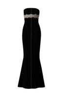 Black Phan Huy gown with a straight long silhouette and intricate bead detailing on the bodice and sleeves.