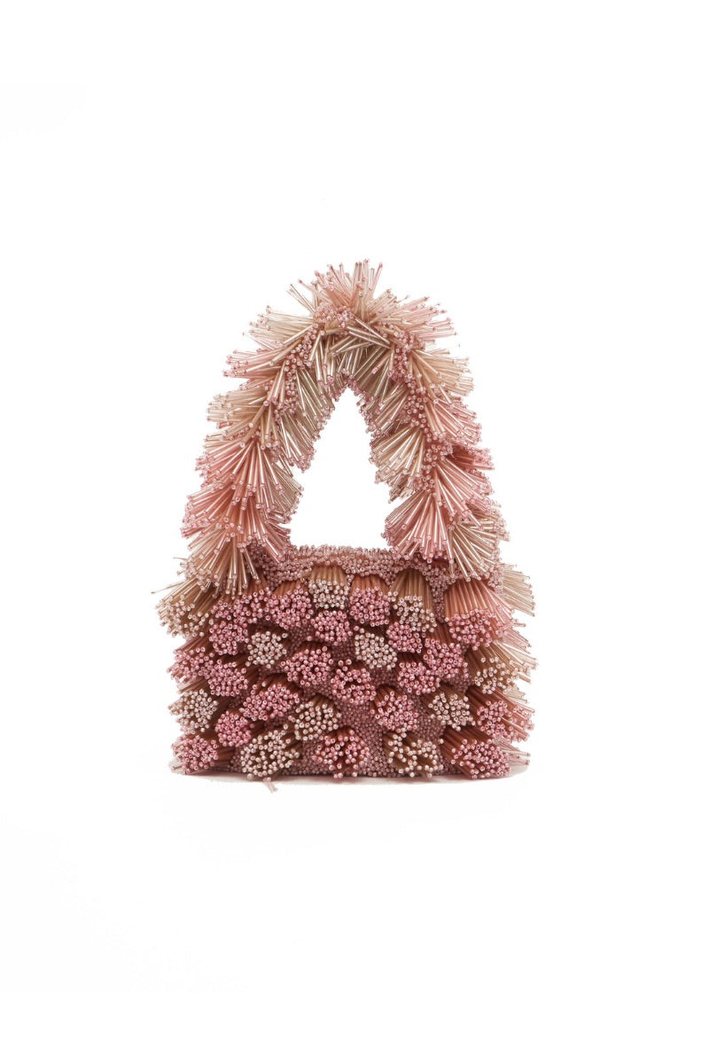Onalaja ZAZA blush top handle bag with sleek design and minimalist style, featuring a smooth finish and elegant handles.