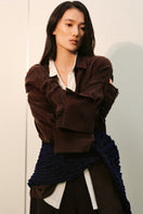 Oversized double-layer cuff shirt by Leicia featuring a relaxed fit and stylish layered sleeve design.