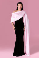 Elegant Nur Karaata Amoura gown with flowing fabric and intricate details, displayed on a dress form.