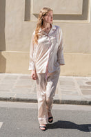 Soft blush pink silk pajama set by Not Just Pajama featuring long sleeves and a relaxed fit, perfect for comfortable sleepwear.