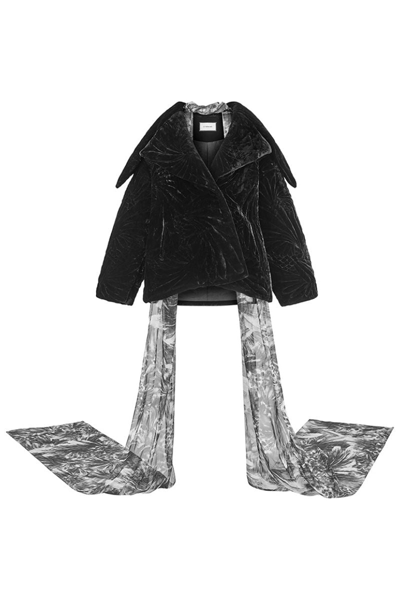 Black quilted coat by Le Thanh Hoa, NIGHTFALL style, featuring a padded design and stylish winter outerwear for cold weather.