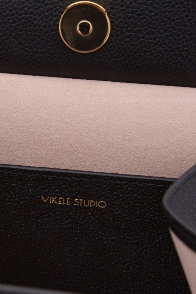 Black CELINE mini top handle bag by VIKELE STUDIO, featuring a sleek design and compact structure for elegant carrying.