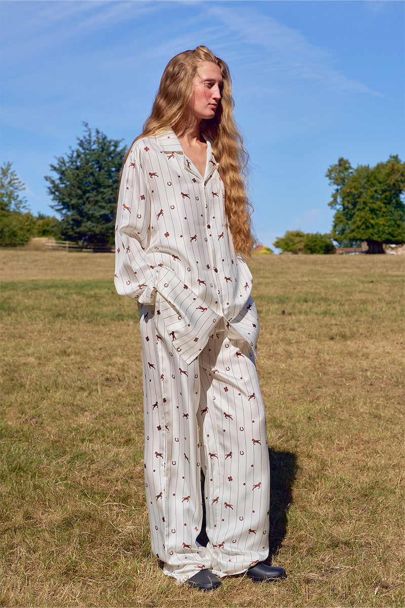 Unisex brown print twill pajamas set featuring a long-sleeve top and matching pants, comfortable sleepwear from Not Just Pajama.