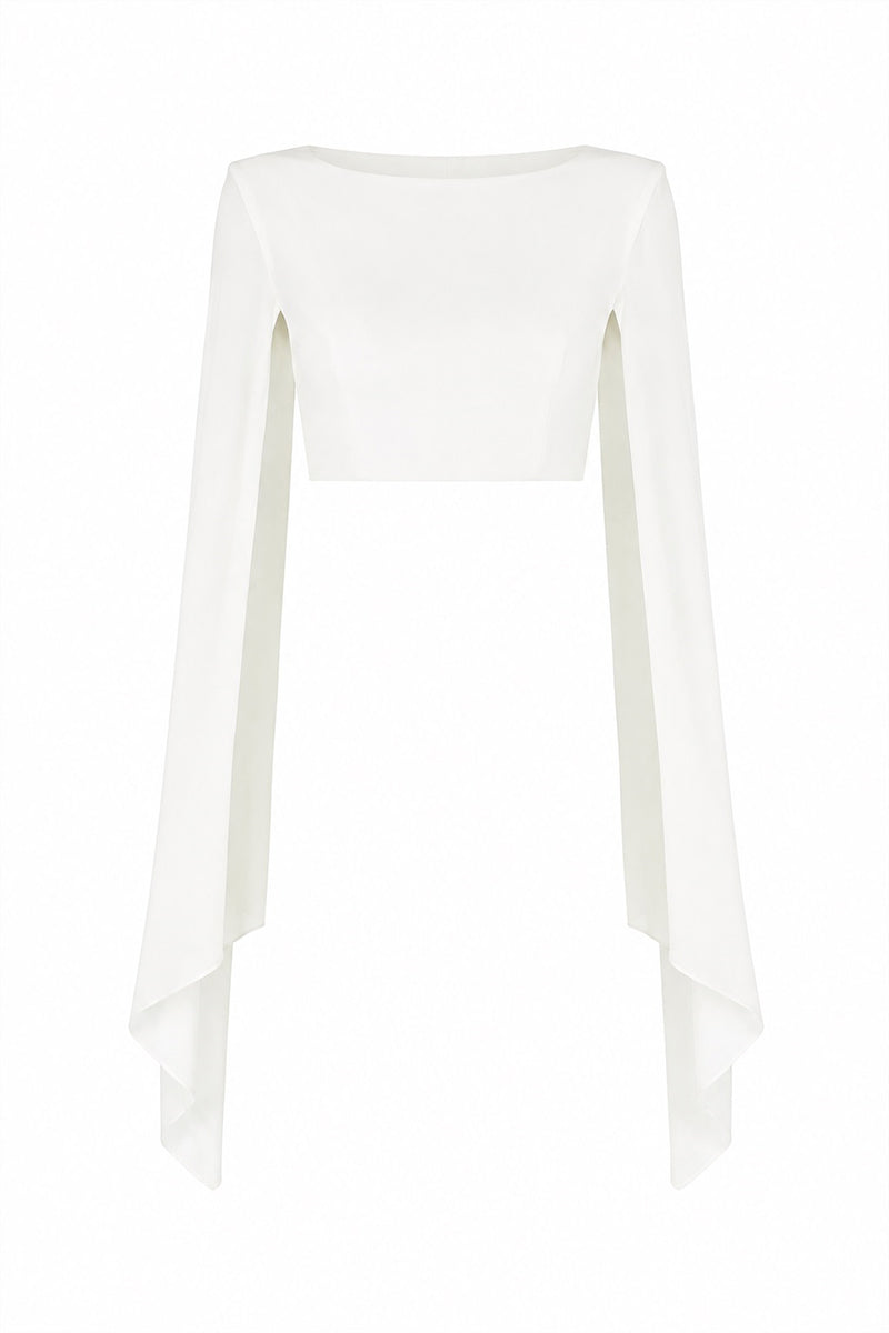 Lili Blanc sculpted cropped top with fitted design and textured fabric, shown on a hanger against a neutral background.