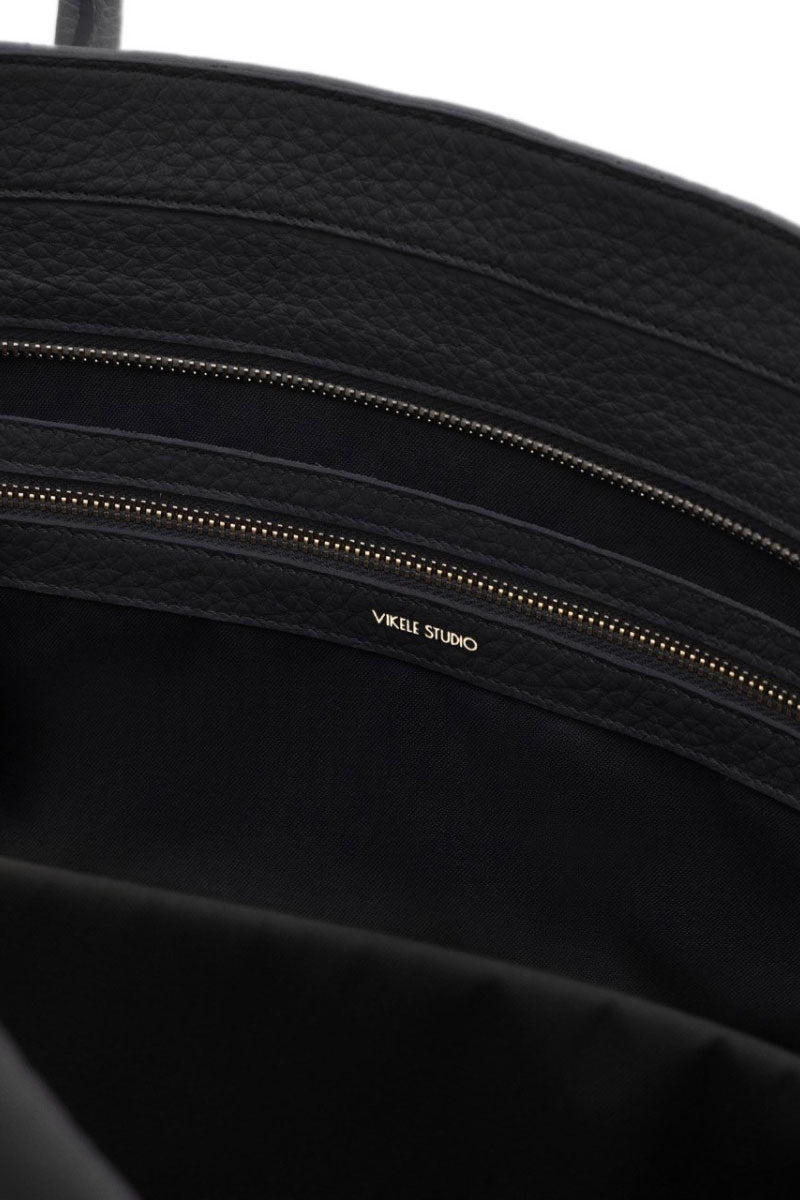 Black Vikele Studio tote bag with shoulder straps, featuring a spacious design and sleek appearance for everyday use.