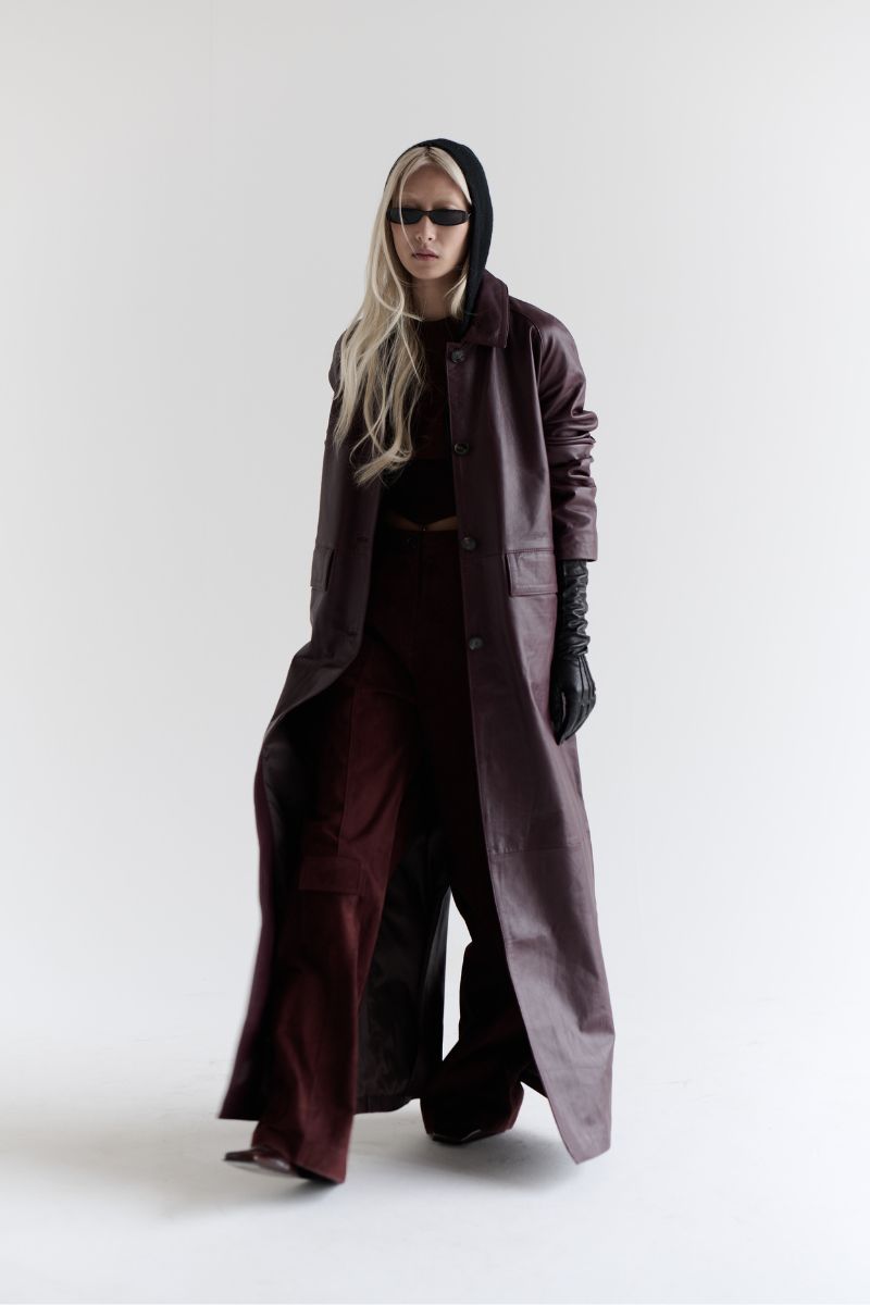 ZUT Palermo leather coat displayed on a hanger, showcasing its stylish design and rich brown leather material.