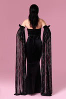 Nur Karaata Daisy Gown featuring floral lace details and flowing fabric, perfect for elegant occasions.