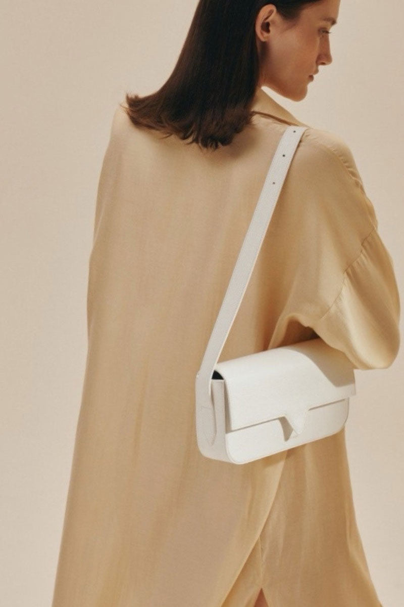 Off-white Katrine shoulder bag by Vikele Studio featuring a sleek design and minimalist style, shown in a close-up shot.