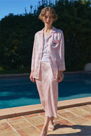 Pink silk bias midi skirt from KIKI CAT 22 MOMME MULBERRY collection, featuring a flowy, elegant design with a smooth finish.