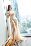 Do Long nude silk evening gown with elegant draped fabric and floor-length design, perfect for formal occasions.
