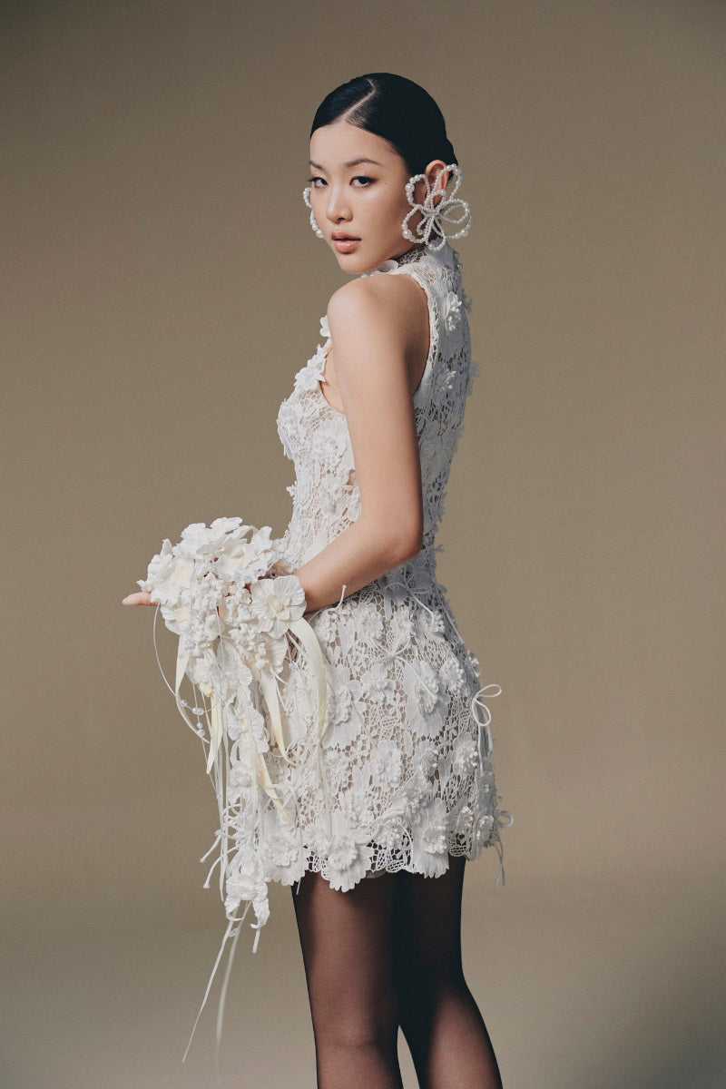 Keira Tong Belle Jardin mini dress featuring a flowy floral design and short sleeves, perfect for casual or summer wear.