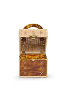 Waiwai Rio Cacau Turtle top handle bag featuring a textured leather finish and a rounded turtle-shaped design with top handle.