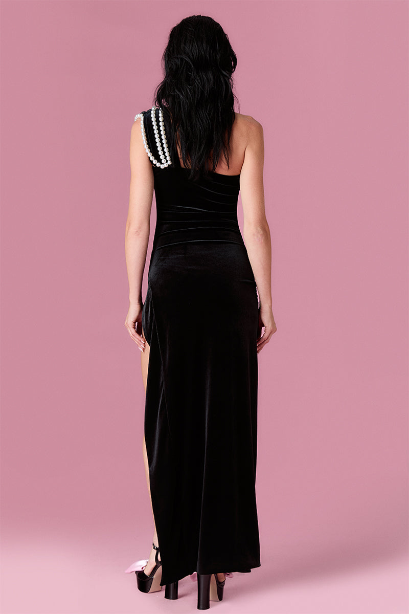 Nur Karaata Midnight Muse gown featuring elegant black fabric, fitted bodice, and flowing skirt for formal occasions.