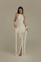 White POEM ELARA maxi dress with flowing fabric and elegant design, perfect for summer or special occasions.