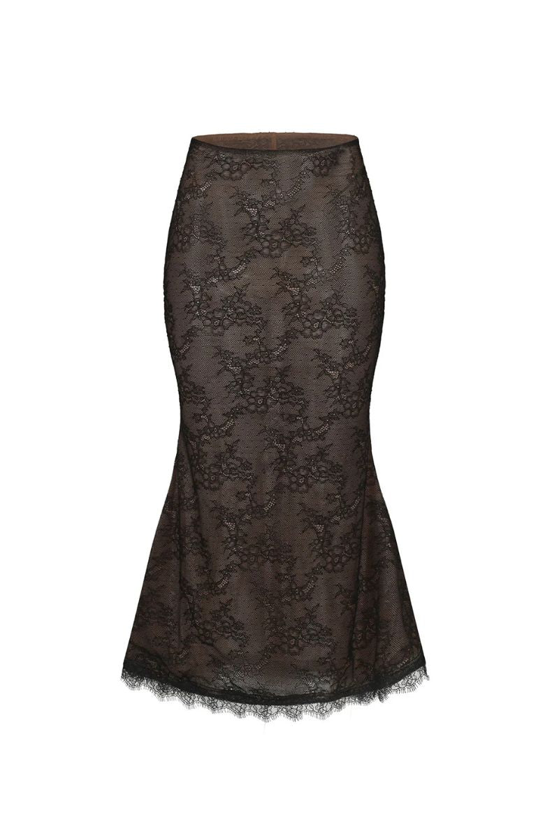 Black Nana Jacqueline Evelina midi skirt shown on a model, featuring a sleek, fitted design and elegant length.