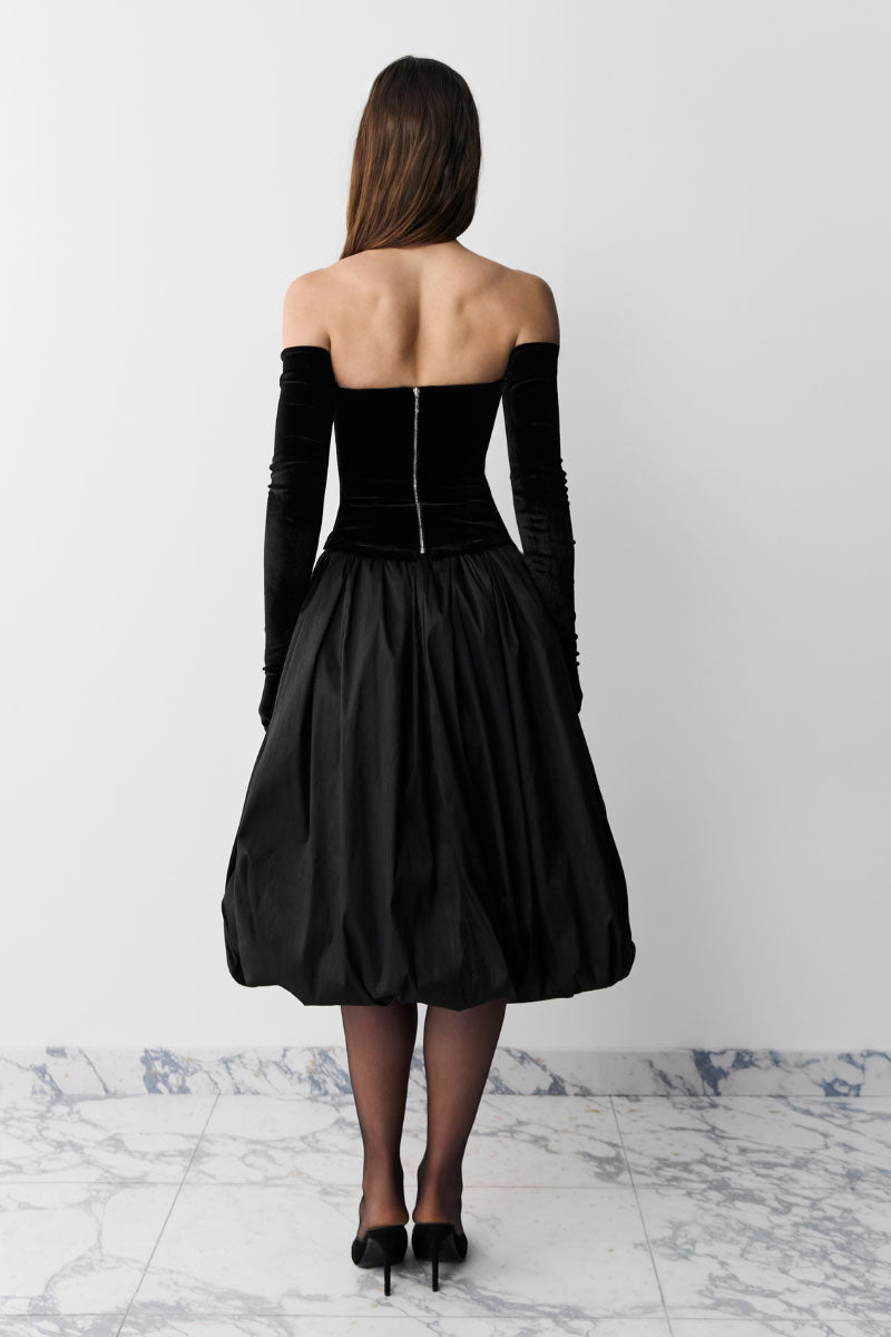Black TRANSFORMER MIDI SKIRT by BALYKINA, stylish mid-length skirt with a sleek design, perfect for versatile fashion looks.