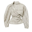 Leica twisted plaid top featuring a stylish pattern and relaxed fit, perfect for casual wear.