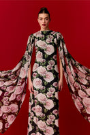 Nur Karaata Marianne maxi dress featuring a flowing fabric, elegant design, and vibrant pattern perfect for summer or special occasions.