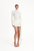 Khanum's white mini dress featuring a fitted silhouette and sleeveless design, perfect for casual or semi-formal wear.