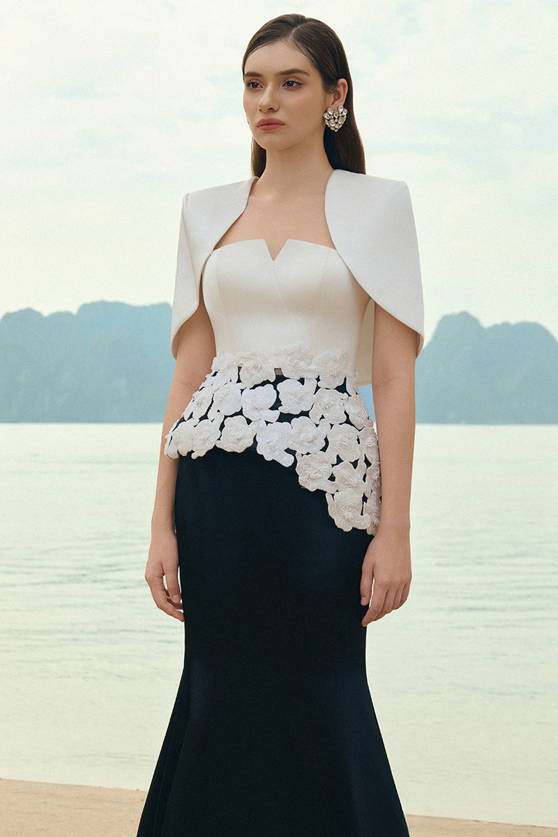 Lune De Soie pearl taffeta co-ord dress and cape set displayed on a mannequin with elegant design details.