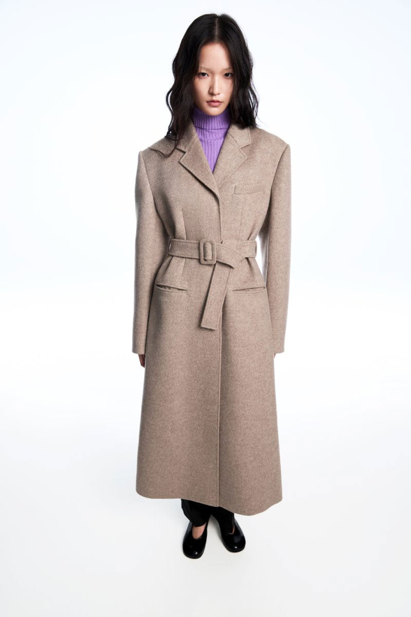 Chictopia belted long line coat in neutral fabric, featuring a tailored fit and stylish belt detail for a chic winter look.