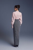 Pink New Thera shirt by Keira Tong, shown in a close-up of the soft, pastel-colored fabric and stylish collar detail.