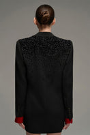 Black oversized double-breasted blazer by I.H.F Studio, tailored fit with wide lapels and long sleeves, displayed on a hanger.