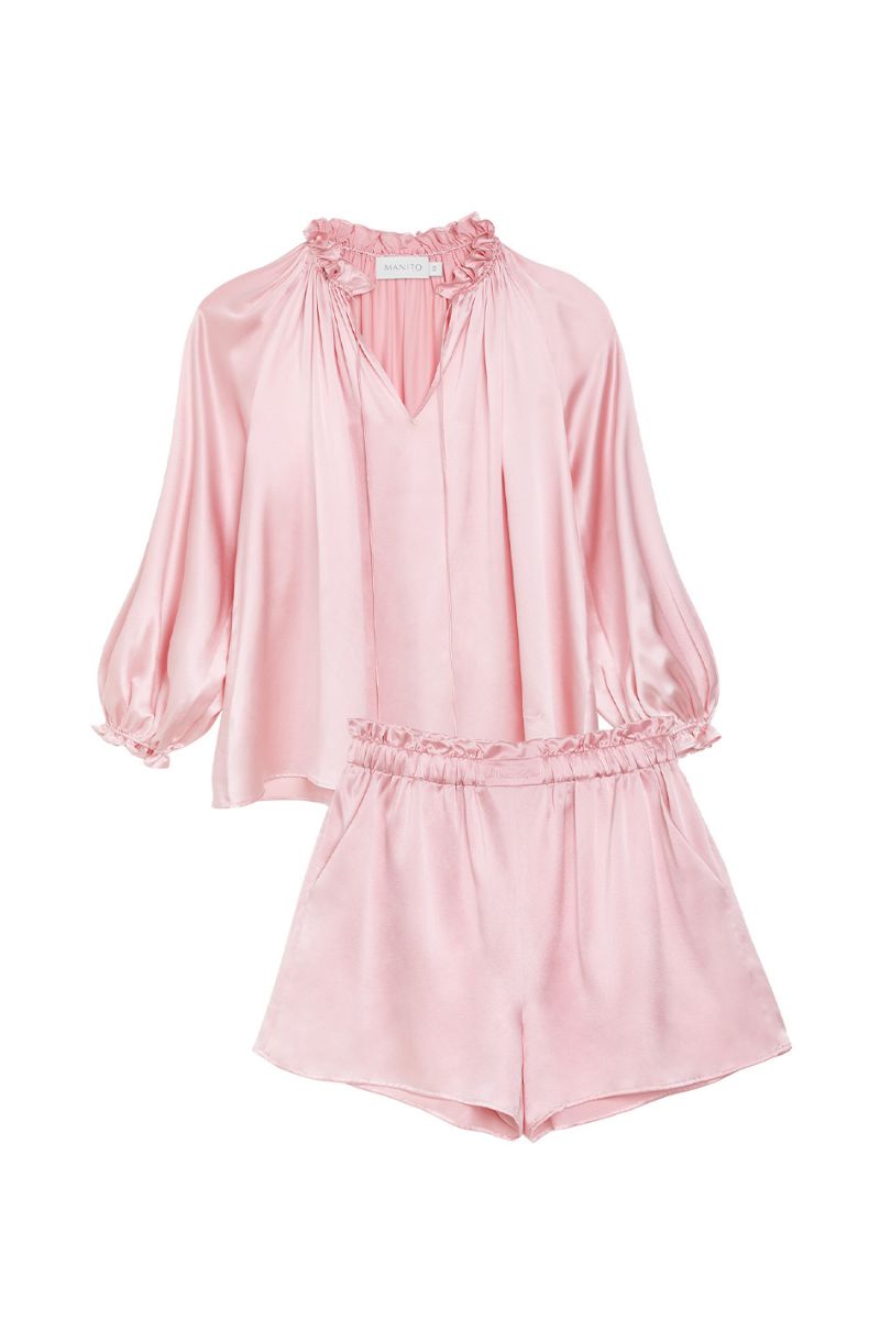 MANITO Sophia ruffle trim pink loungewear set featuring a blouse with ruffled details and matching shorts.