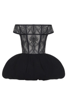 Black THEA mini dress by BALYKINA displayed on a hanger with a fitted silhouette and stylish design.