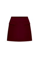 Nazlı Ceren Bordeaux mini skirt, stylish high-waisted skirt in deep burgundy, shown on a mannequin with front view and subtle fabric details.