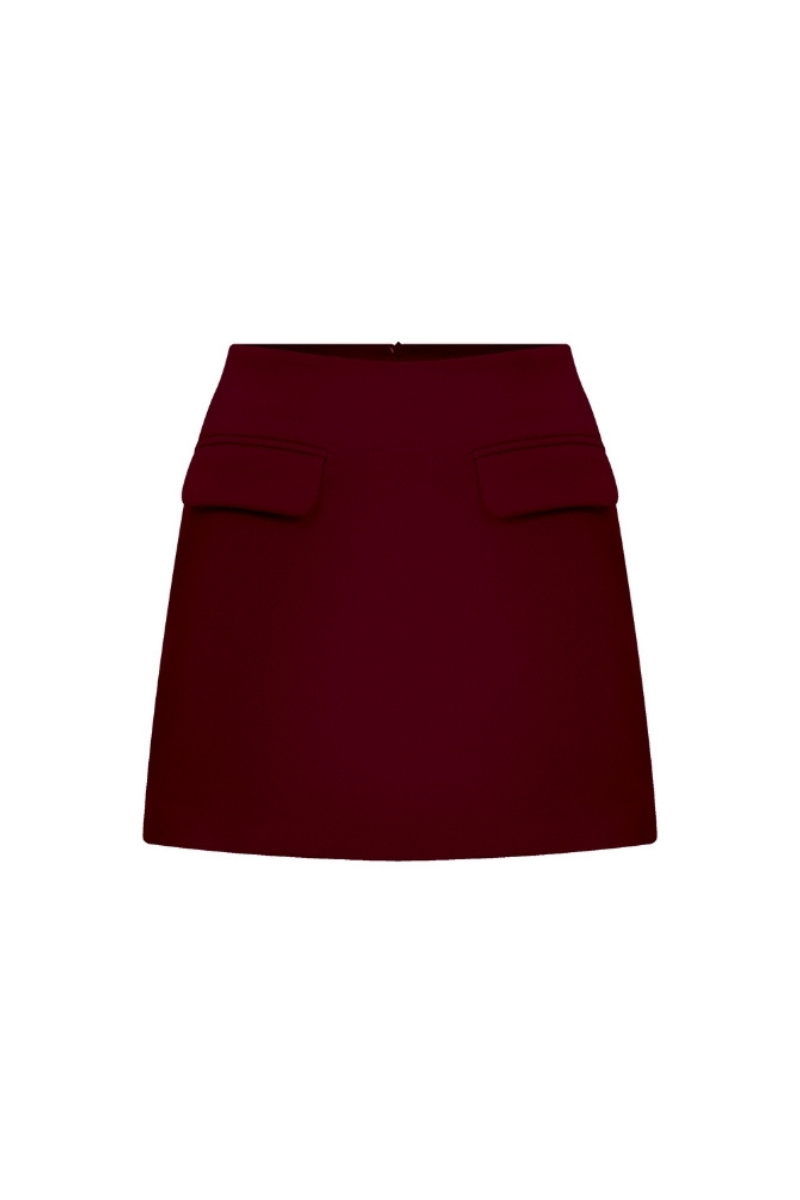 Nazlı Ceren Bordeaux mini skirt, stylish high-waisted skirt in deep burgundy, shown on a mannequin with front view and subtle fabric details.