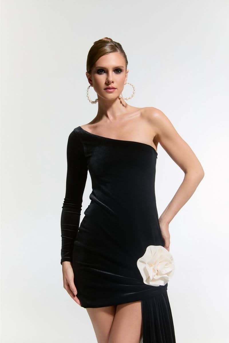 Nur Karaata Cult Mia Connaught velvet mini dress displayed on a hanger with a fitted silhouette and rich velvet fabric.