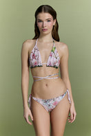 Nur Karaata Sunset Palms bikini top featuring palm print and adjustable straps, shown on a model.